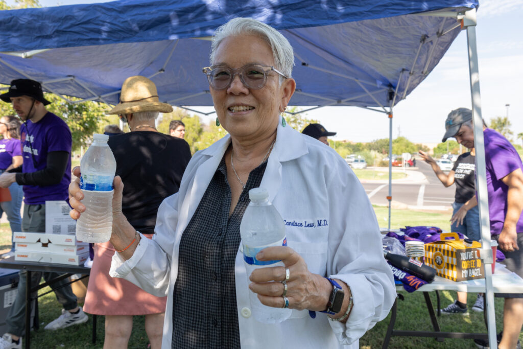 Dr. Candace Lew, M.D. volunteering with yes on prop 139 and handing out waters to Arizona Abortion Access volunteers